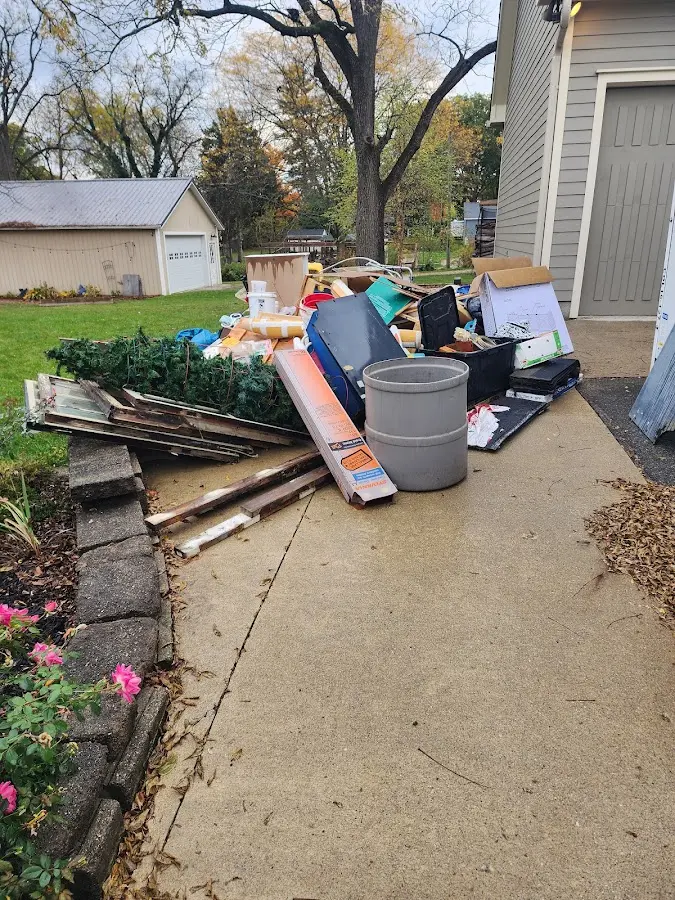 Dumpster being loaded with debris for 10 Yard Dumpster Rental in Athens